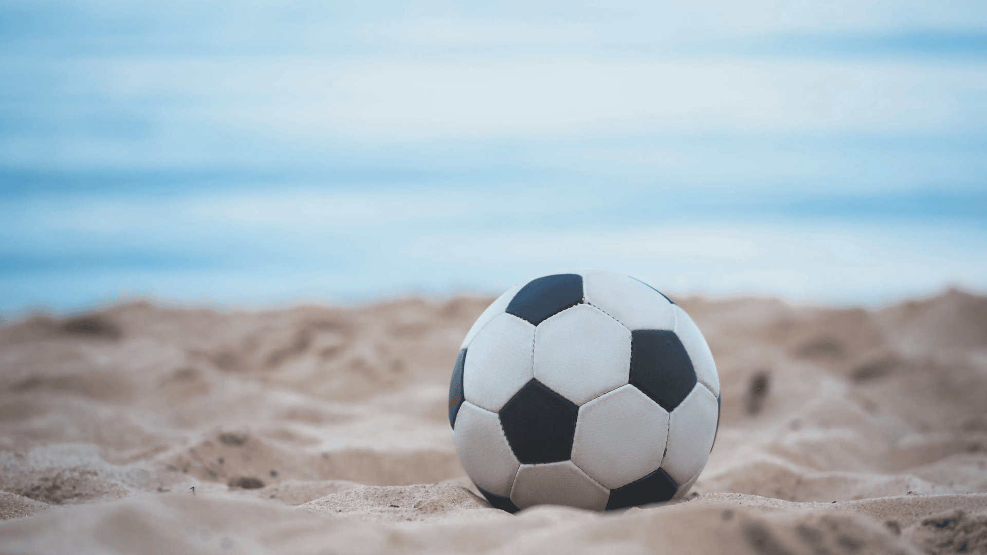 8-fun-second-ezgif.com-resize White and Black Ball on the Sea Sand