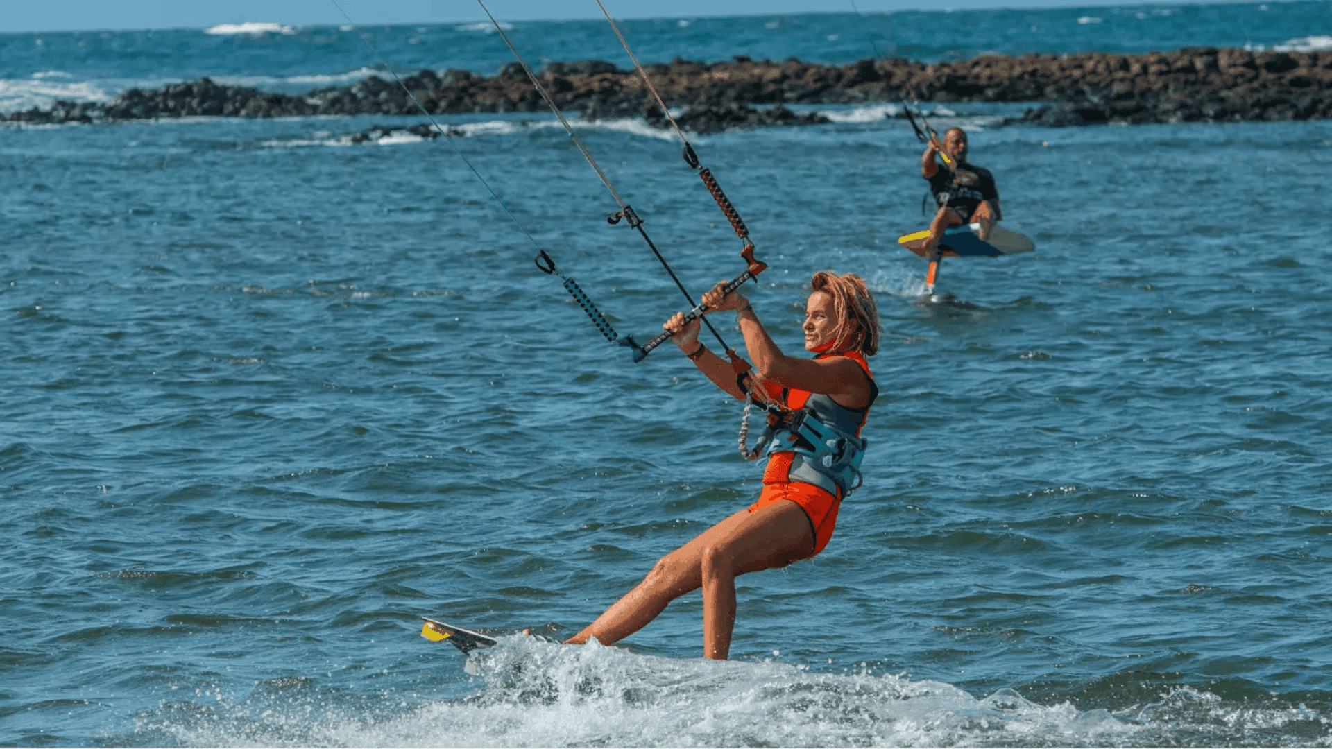 A-woman-kite-surfing-at-west-beach A-woman-kite-surfing-at-west-beach