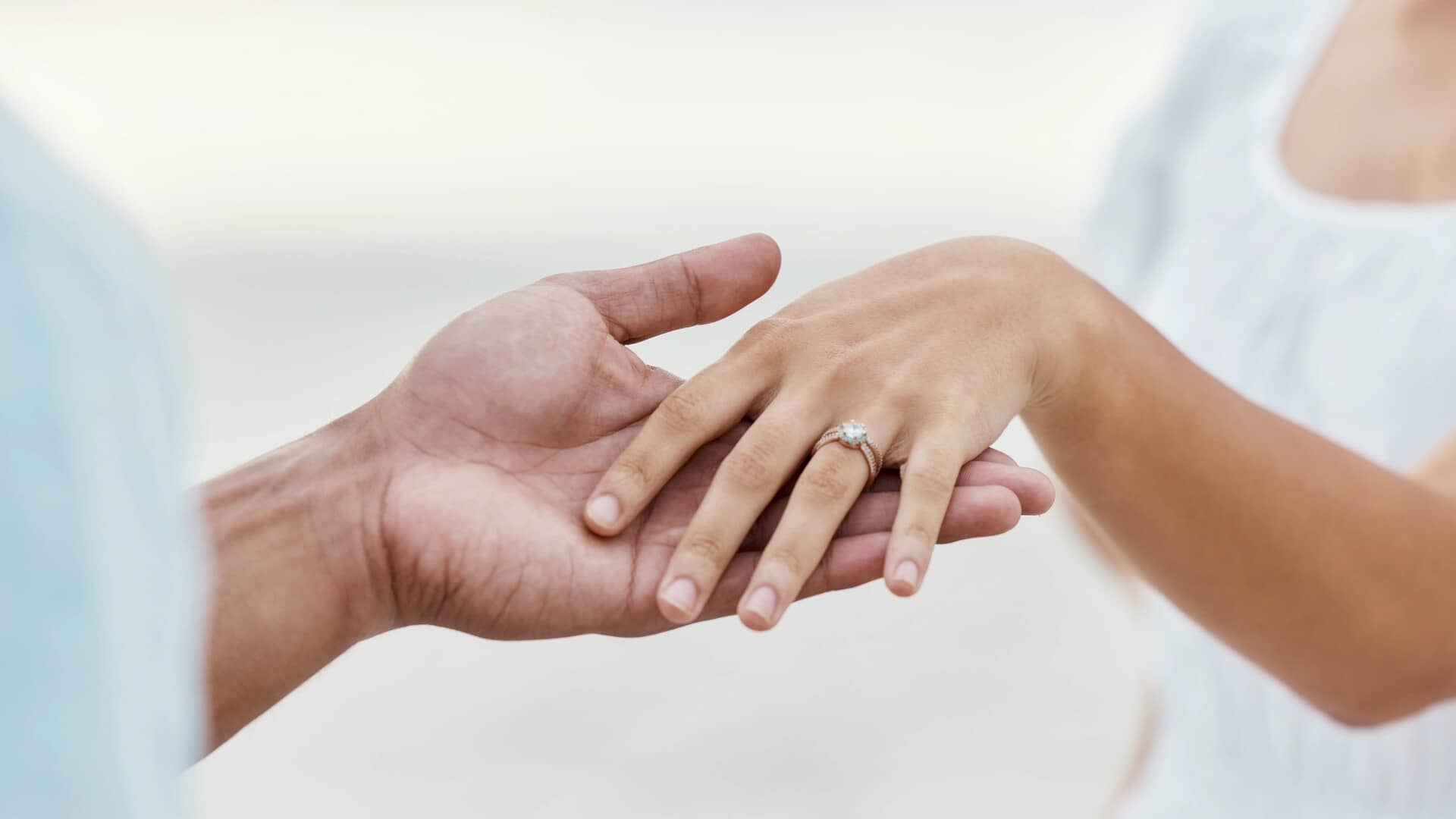 engagement-proposal-couple-hand-and-marriage-ring Engagement Proposal Couple Hand and Marriage Ring