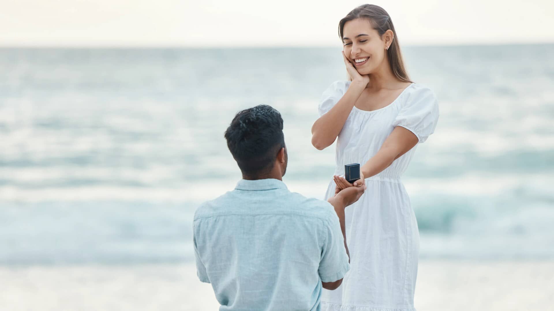 love-beach-and-a-proposal-a-couple-with-engagement-ring Love Beach and- a Proposal a Couple with Engagement Ring