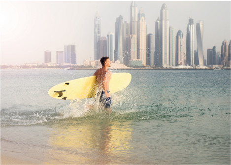 stand up paddling in dubai A Man Holds a Paddle Board in Dubai